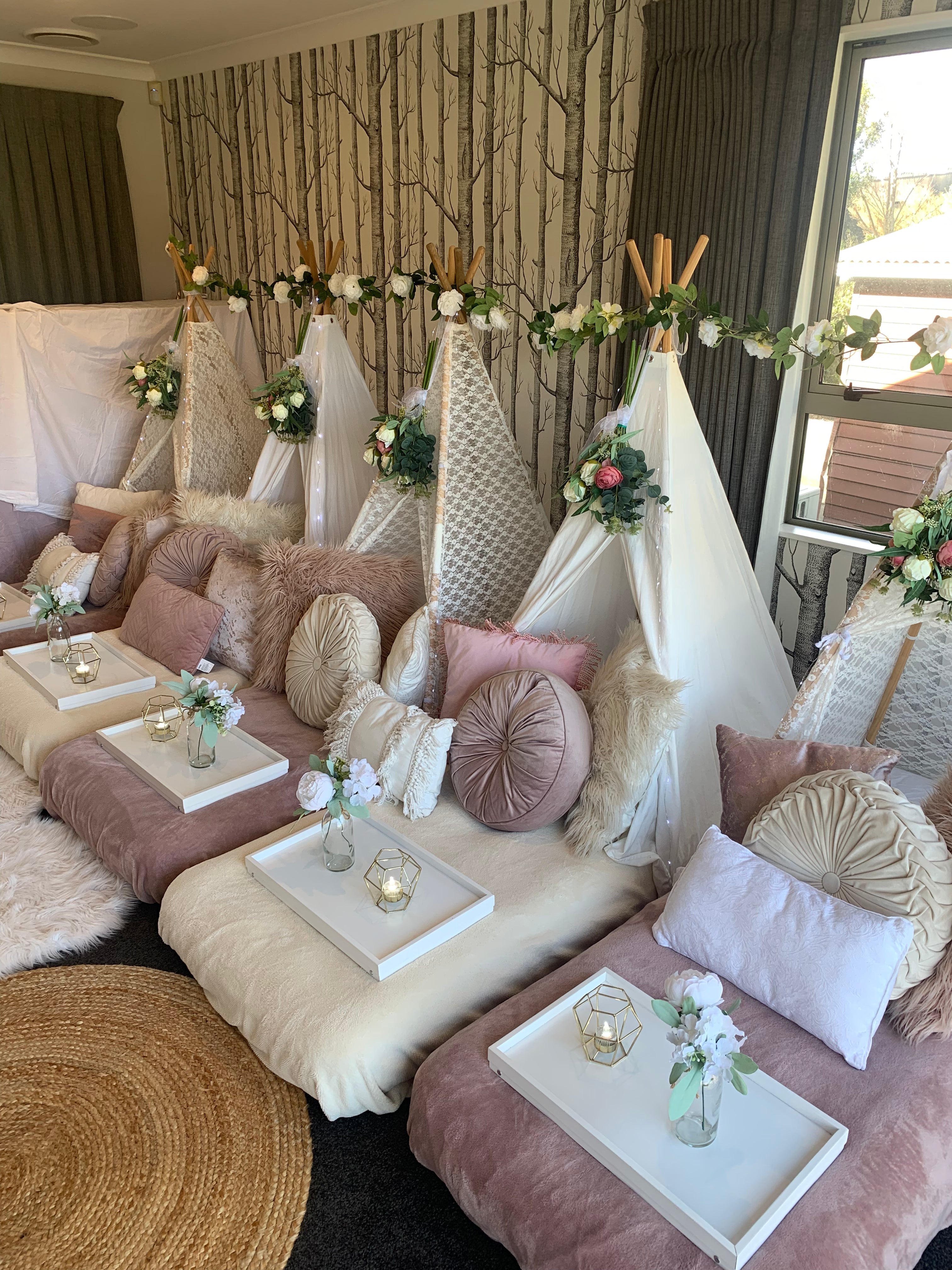 Blooming floral white and blush pink teepee setup Wellington