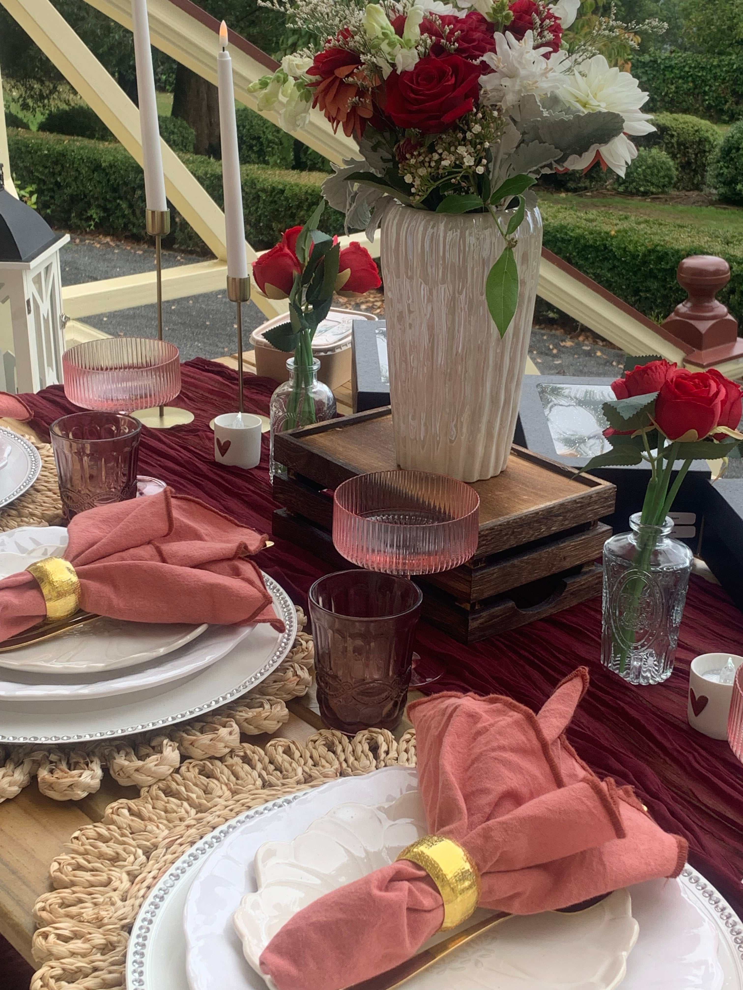 Blush pinks and red roses for a perfect engagement proposal picnic in Wellington