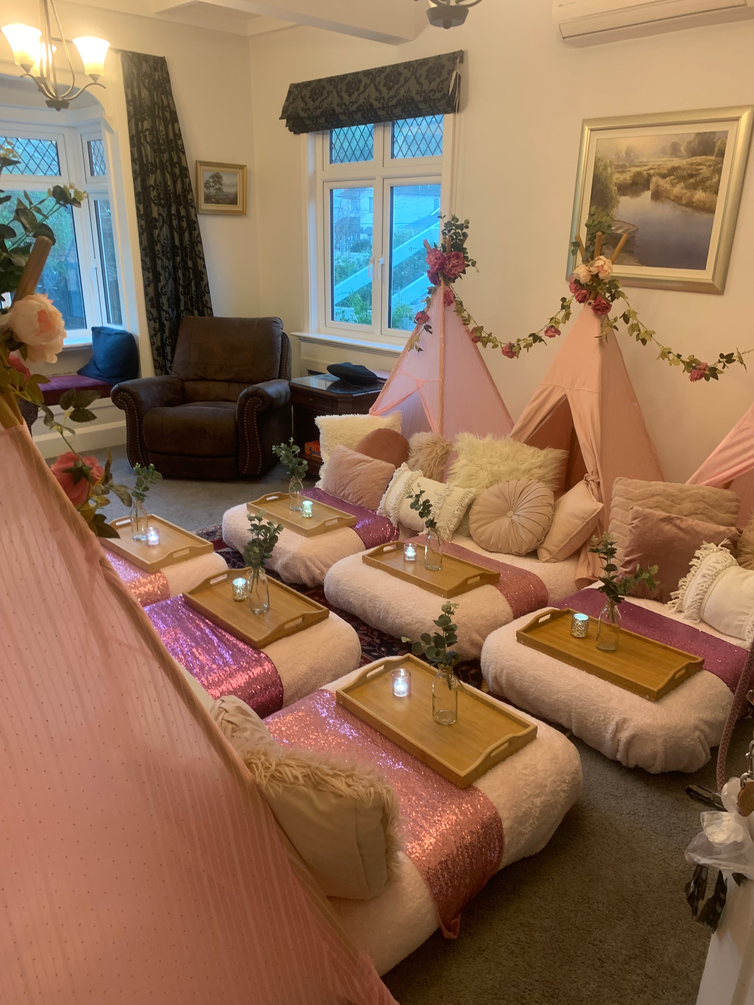 Pink flowers make the perfect teepee party addition for a Wellington birthday celebration